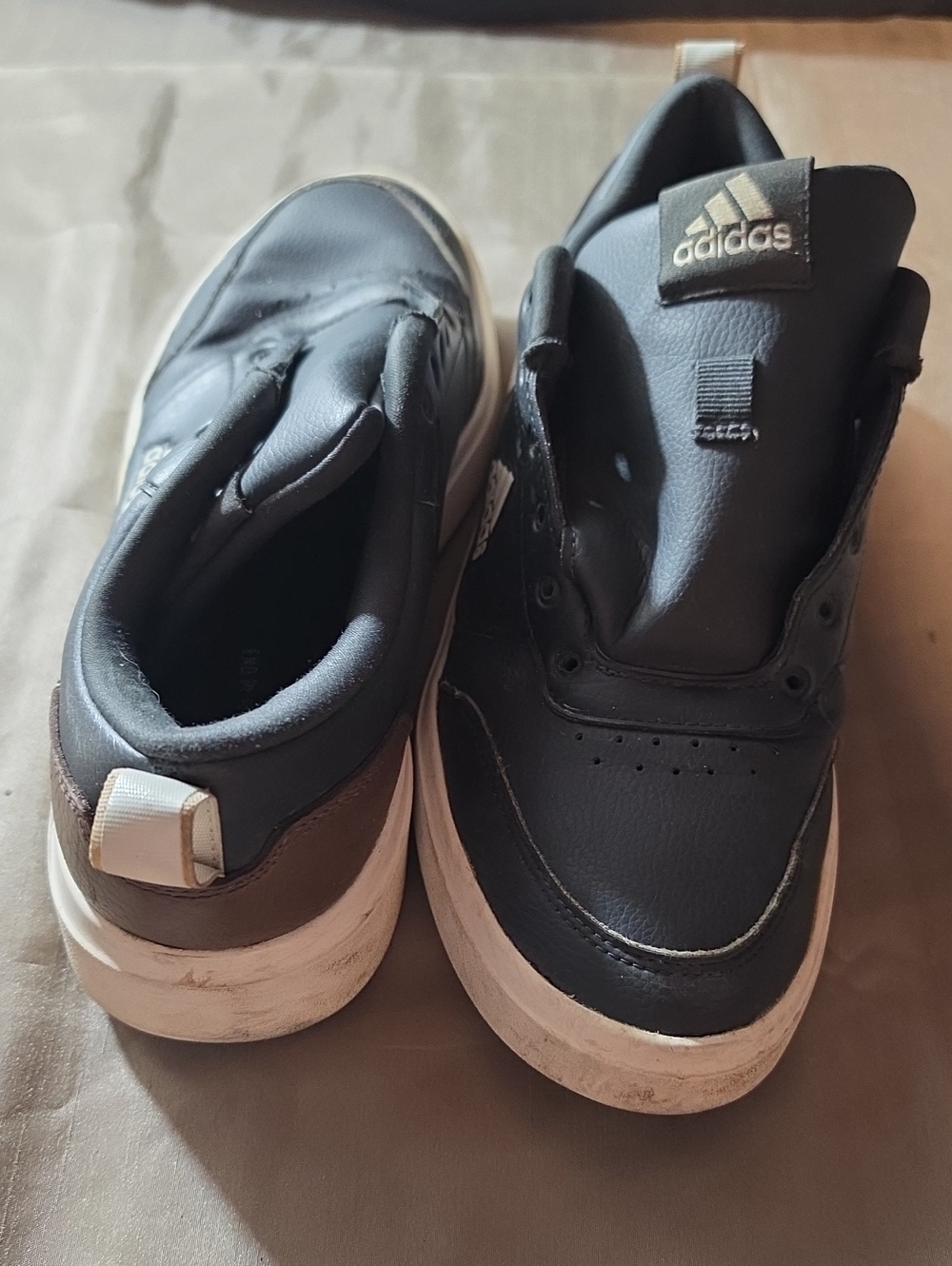 Adidas Black Sneakers with White Soles and Brown Heel Accent